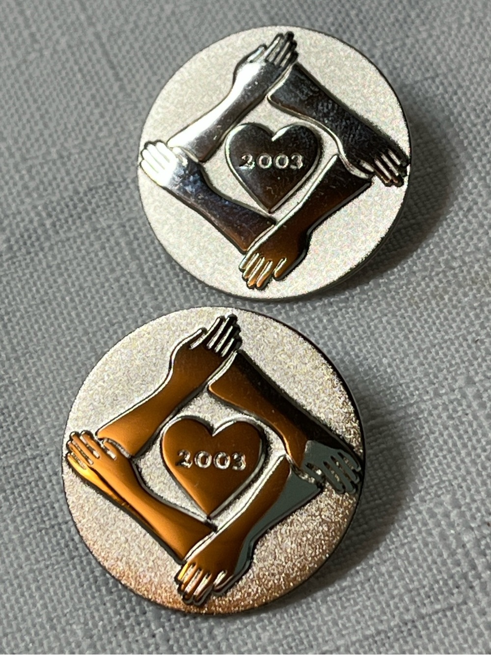 Sandra Schmirler Foundation pins, a Canadian symbol of hope.